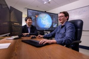 WVU engineers including Hang Woon Lee, left, and Brycen Pearl have developed a satellite positioning system that improves the detection of wildfires from space. (WVU Photo/Brian Persinger)