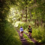 Two cyclists bike the West Fork Rail Trail near Durbin in the Monongahela National Forest.