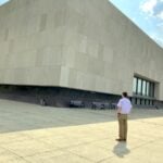 Historian and West Virginia Explorer correspondent Cody Straley stands before the West Virginia Culture Center in Charleston, whose clean lines and imposing Brutalist design have made it one of the state's most recognizable public buildings since opening in 1976.