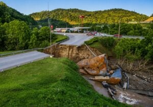 A roadway washed away during the devastating June 2016 floods illustrates the force of floodwaters that destroyed roads, bridges, homes, and businesses across central and southern West Virginia. The disaster claimed 23 lives and became one of the costliest natural disasters in state history.