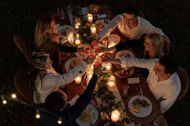Diners gather around a communal outdoor table to enjoy dishes inspired by West Virginia's Appalachian food traditions, reflecting the state's growing reputation as a destination for authentic local cuisine. (Photo courtesy Ahmet Kurt)