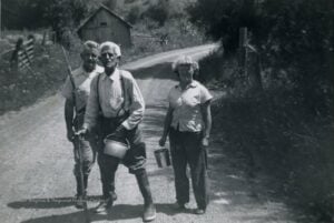 A Monroe County family gathers wild berries in the summer of 1952, reflecting a long-standing Appalachian tradition that provided food, preserved seasonal harvests, and brought generations together. (Photo courtesy of the W.Va. Regional History Collection)