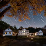 Star trails sweep above Blennerhassett Mansion during Mansion by Candlelight at Blennerhassett Island Historical State Park. The annual event returns Oct. 9–10, 2026. (Photo courtesy Greater Parkersburg CVB)