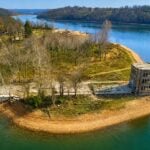 The ruins of William “Coin” Harvey’s Monte Ne resort stand along the shore of Beaver Lake in Arkansas, remnants of the ambitious community he developed in the Ozarks in the early 20th century.