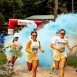 Participants run through a cloud of colored powder during a previous Color Dash for Hope at ACE Adventure Resort near Oak Hill, West Virginia. The 5K returns Saturday, Aug. 29, to raise funds for addiction recovery efforts across Appalachia. Photo courtesy ACE Adventure Resort.
