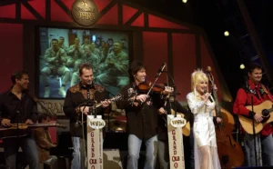 Dolly Parton performs at the Grand Ole Opry in 2005. Photo: Tech. Sgt. Cherie A. Thurlby/U.S. Air Force. Public domain.