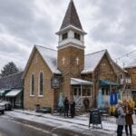 A light snowfall dusts Cathedral Cafe in downtown Fayetteville as residents gather during winter. Organizers of Fayetteville Creates hope the annual artist residency will help establish the New River Gorge community as a year-round creative destination.
