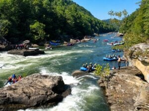 Rafters gather along the Gauley River during Gauley Season in West Virginia, when scheduled releases from Summersville Dam create some of the nation's best-known whitewater. (NPS photo)