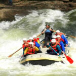 Rafters charge through whitewater on the Gauley River during Gauley Season in West Virginia. The six-week fall season draws thousands of whitewater enthusiasts to the river each year. (NPS photo)