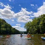 Paddlers make their way down the Greenbrier River in southeastern West Virginia, where cool mountain water, forested shorelines and higher elevations have long provided an escape from the summer heat. (Photo courtesy Kirstin Cole)