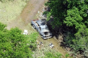 Floodwaters and debris surround a vehicle in Greenbrier County following the catastrophic June 2016 flooding, when repeated thunderstorms produced record streamflows across parts of West Virginia. (U.S. Army National Guard photo by Sgt. Penni Harris)