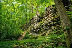 Sandstone cliffs rise above Jumonville Glen in southwestern Pennsylvania, where George Washington's forces encountered a French patrol in May 1754, helping ignite the French and Indian War and the wider Seven Years' War.