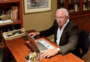 Kenny Bryant, chief executive officer of All-West Virginia MLS, works from his home office. (Photo courtesy David Chinn)