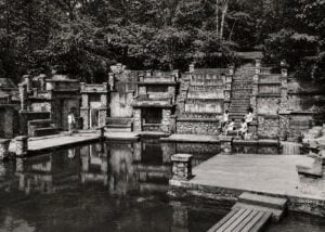 Visitors gather around the elaborate stone swimming pool at William “Coin” Harvey’s Monte Ne resort in Arkansas, part of the ambitious Ozark development he began in the early 1900s.