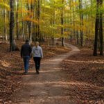 A couple walks a wooded trail at Pipestem Resort State Park, where the West Virginia Trails Conference will be held Nov. 8–10, 2026.