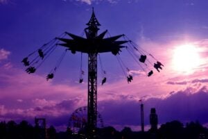 Riders soar above the midway on a swing ride as evening settles over the State Fair of West Virginia in Lewisburg. (Photo courtesy Greenbrier Valley Convention and Visitors Bureau)