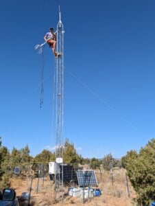 WVU researcher Steve Kannenberg works on a flux tower at Bears Ears National Monument in Utah, where he spent five years collecting data on how ecosystems exchange carbon, water and energy with the atmosphere — a process he describes as how ecosystems “breathe.” (Submitted photo)