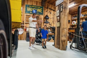 Visitors explore the Transportation Museum at Heritage Farm Museum and Village near Huntington, West Virginia. One of seven museums at the state's only Smithsonian Institution Affiliate, the exhibit traces the innovations and vehicles that helped shape Appalachian communities and the growth of the Ohio Valley. (Photo courtesy Heritage Farm)