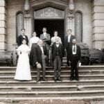 Professional staff members of the West Virginia Hospital for the Insane in Weston pose outside the institution circa 1894–1900. Dr. Lorilla F. Bullard, who testified during the 1899 investigation of Superintendent W.E. Stathers, is standing at front left. The historic photograph has been digitally enhanced for clarity to improve accessibility for readers with limited vision. (West Virginia and Regional History Center, WVU Libraries)
