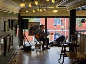 An artist performs inside a gallery in Hinton's National Historic District, where arts, historic buildings and locally owned businesses are already contributing to downtown revitalization. The proposed New River Gorge Artisan Corridor would seek to connect such activity with communities throughout the region.