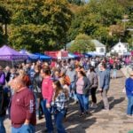 Crowds fill downtown Berkeley Springs, West Virginia, during the annual Apple Butter Festival, which returns Oct. 9–11 for its 51st year despite spring freezes that damaged the region’s apple crop.