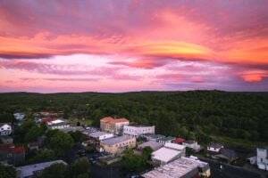 Lenticular clouds form above Davis, West Virginia, at sunset. The smooth, lens-shaped clouds can develop when winds cross mountainous terrain and create waves in the atmosphere, another visible consequence of the high-elevation geography surrounding the state’s highest incorporated community.