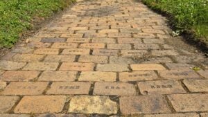 Historic paving bricks remain underfoot in New Cumberland, W.Va., where more than 20 brick plants once operated along the Ohio River and shipped millions of bricks to markets across the country. (Photo by David Sibray)
