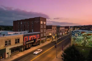 Downtown Princeton glows at dusk in the city’s Grassroots District, where murals, public art, historic buildings, shops, and cultural venues have helped revitalize the Mercer County community. Princeton, at more than 2,400 feet above sea level, is among West Virginia’s highest cities.