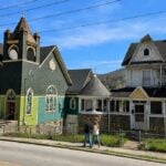 Two properties proposed for inclusion in an expanded historic district stand along a residential street in Richwood, West Virginia. The proposed expansion would extend the existing downtown district into nearby residential areas.