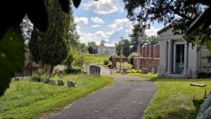 Alfred Beckley’s home, Wildwood, is seen from the grave of his wife, Emily, at Wildwood Cemetery in Beckley, West Virginia. Beckley could look from his home across the Giles, Fayette and Kanawha Turnpike toward Emily’s grave on the cemetery knoll. The historic relationship between the house and grave is now partly obscured by later development between the two sites.