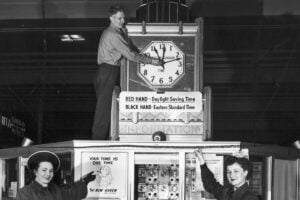 Historic New Haven Railroad clock displaying both standard time and daylight saving time, illustrating the challenges of railroad scheduling before uniform federal timekeeping rules.
