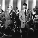 Bandleader Kay Kyser (left) shares the stage with comedian and former WVU law student Ish Kabibble (Merwyn Bogue) in a promotional publicity still for the 1943 film Swing Fever.