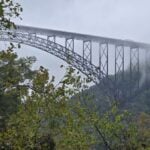 New River Gorge Bridge surrounded by fog in the mountains of southern West Virginia.