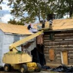 Workers restore the roof of the historic Tyree Tavern in Ansted, West Virginia. Dating to approximately 1810, the former stagecoach inn is being rehabilitated as a museum and cultural facility. A new $28,000 preservation grant will support window restoration. (Photo courtesy Pam Webster-Walsh)
