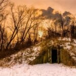 An earth-covered concrete bunker stands in the woods of the former West Virginia Ordnance Works near Point Pleasant, W.Va. Built to store explosives during World War II, the bunkers later became associated with the area's Mothman legend. (Photo by Jesse Thornton)