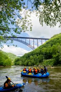 Paddlers gather near New River Gorge Bridge