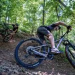 Tracy Toler and his daughter bike a forest trail in southern West Virginia.